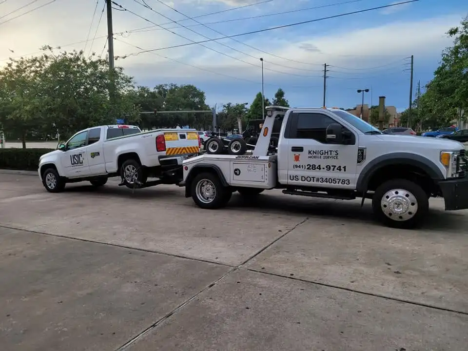 Knights Mobile Service wheel-lift towing a work pickup